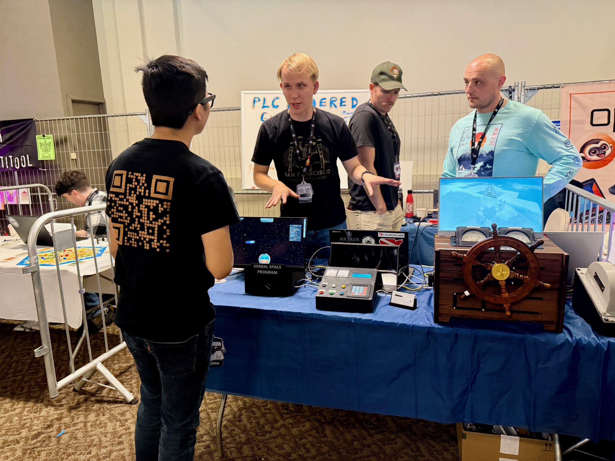 The full PLC gaming booth setup on the table